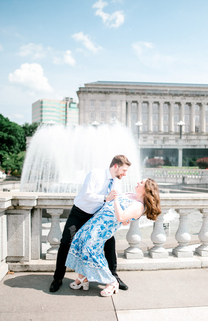 Man holds woman and dips her (as if in a dance) during proposal in Washington D.C.