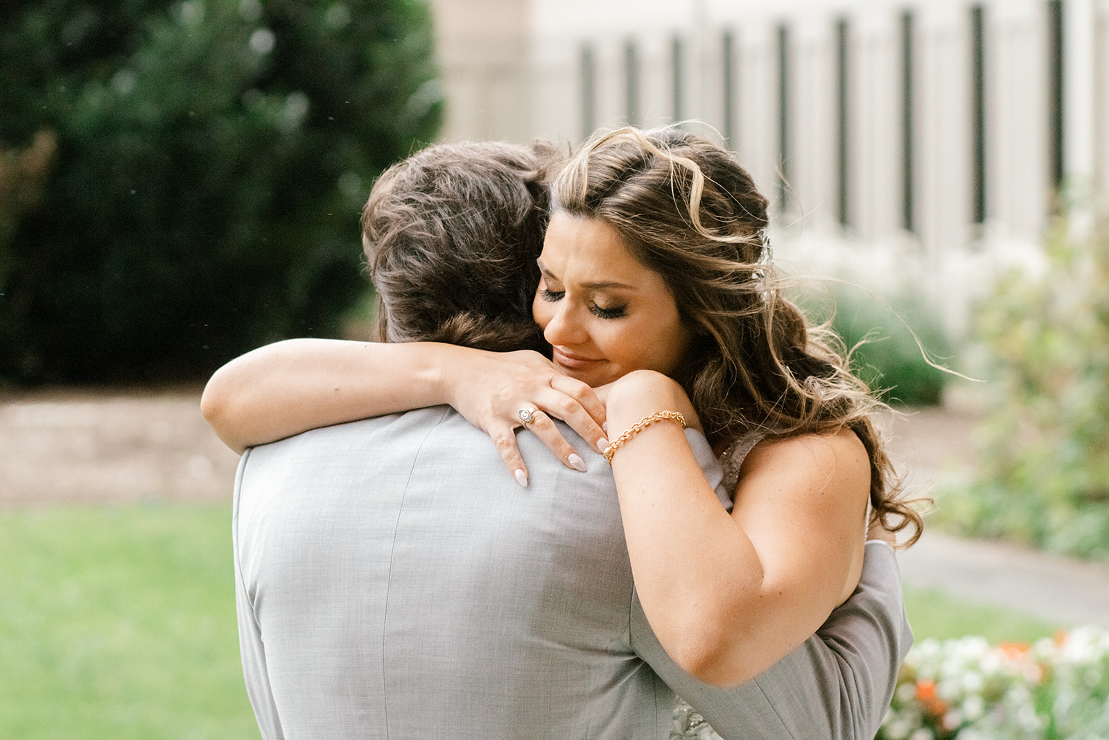 Photographer shares posing tips for couples. Northern Virginia bride and groom embrace with groom facing away from the camera