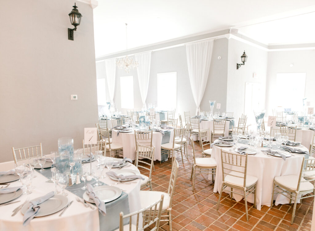 Blue and white table set ups with tan chairs at Northern Virginia wedding venues